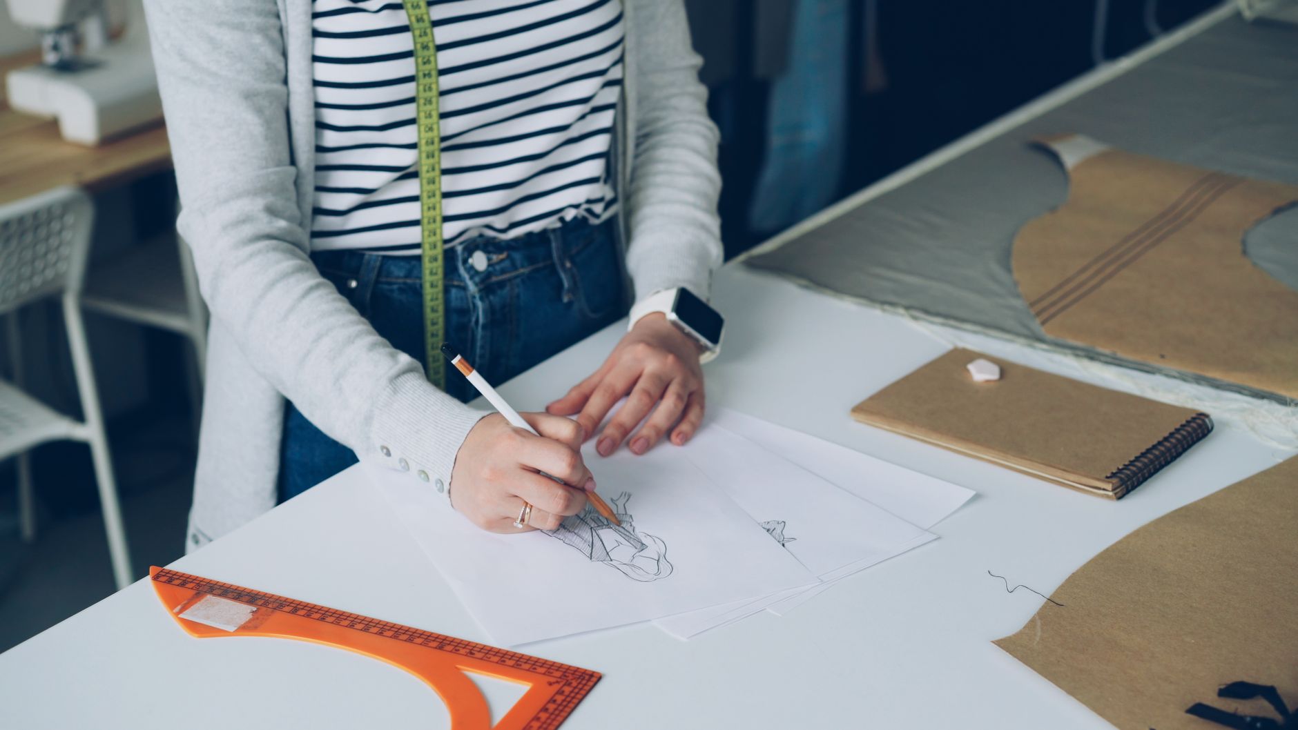 Hand-drawn furniture plans on a workbench